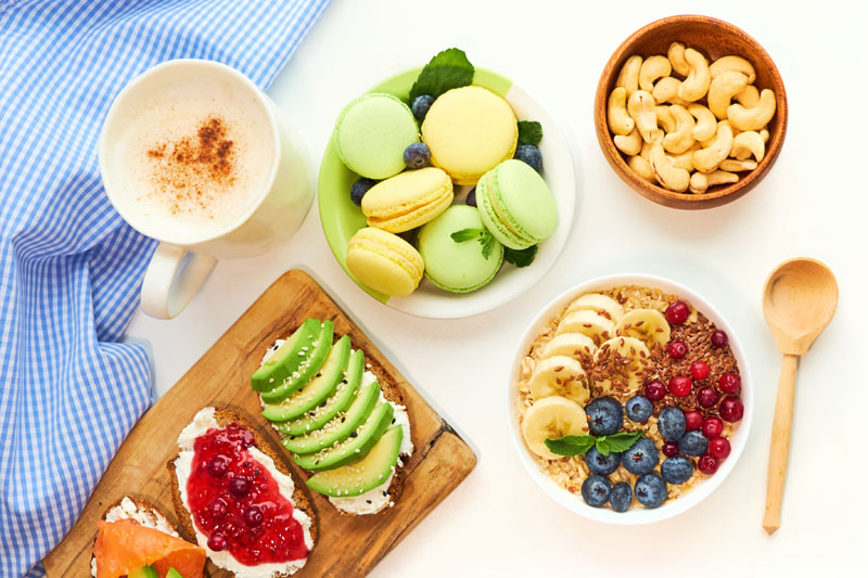 Healthy lactation foods including oatmeal, banana, berries, and nuts to naturally support milk supply during breastfeeding.