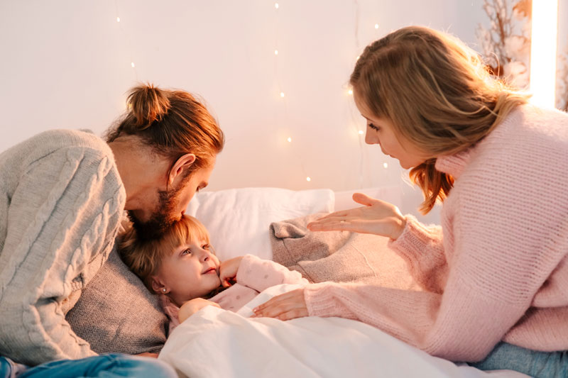 Happy family enjoying dinner together at home, illustrating building family routines for children